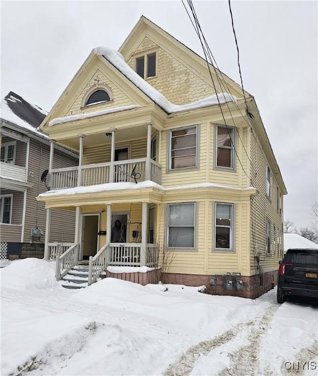 view of front of home with a balcony and a porch