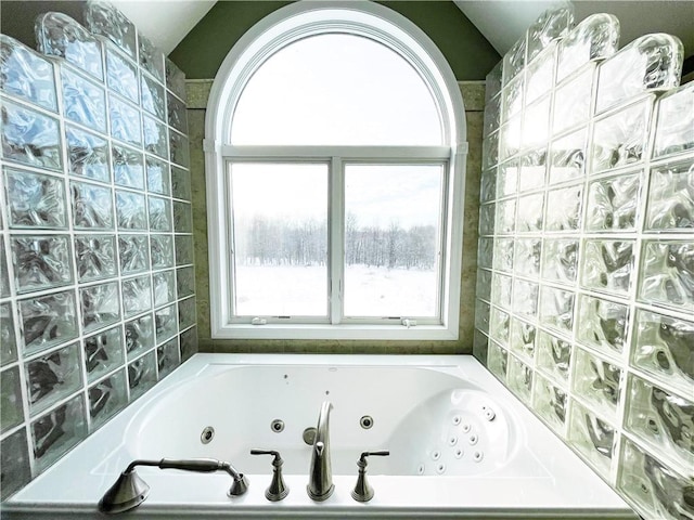 bathroom featuring a tub to relax in