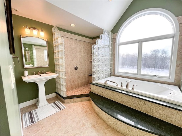 bathroom with tile patterned floors, plus walk in shower, and vaulted ceiling