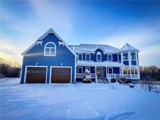 view of front of property with a garage and a porch