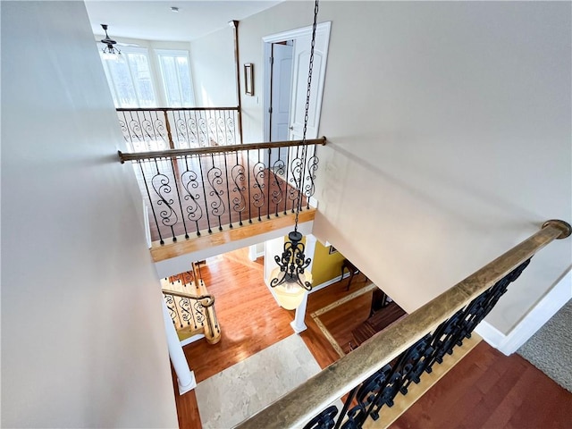 stairs featuring hardwood / wood-style floors