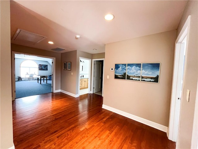 hall with hardwood / wood-style floors