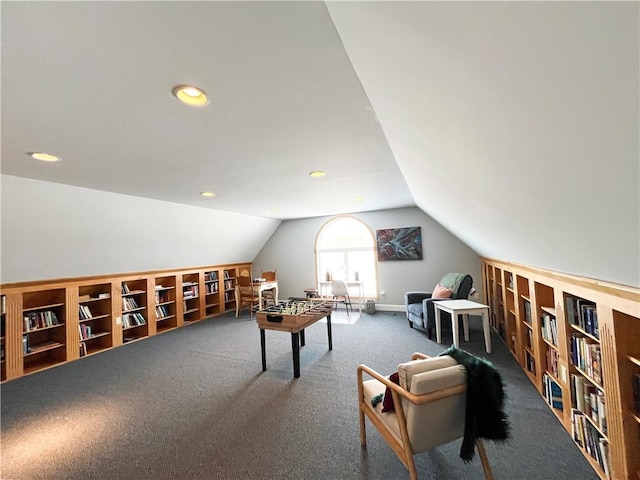 rec room featuring carpet flooring and vaulted ceiling