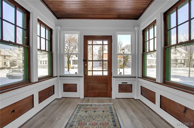 unfurnished sunroom featuring wooden ceiling