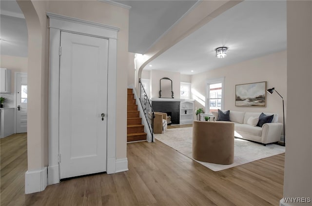 living room featuring a fireplace and light hardwood / wood-style floors