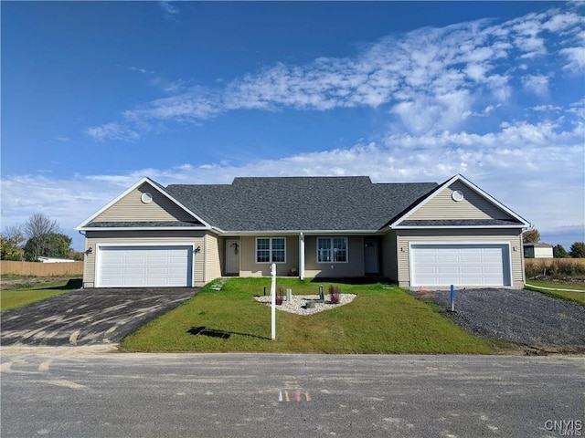 single story home featuring a front yard and a garage