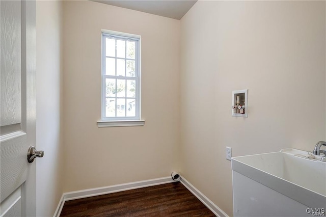 clothes washing area with sink, dark hardwood / wood-style flooring, and hookup for a washing machine