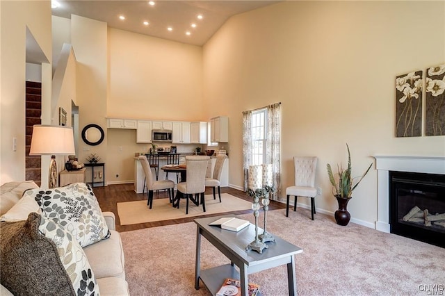 living room featuring high vaulted ceiling