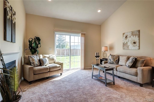 living room with light carpet and lofted ceiling