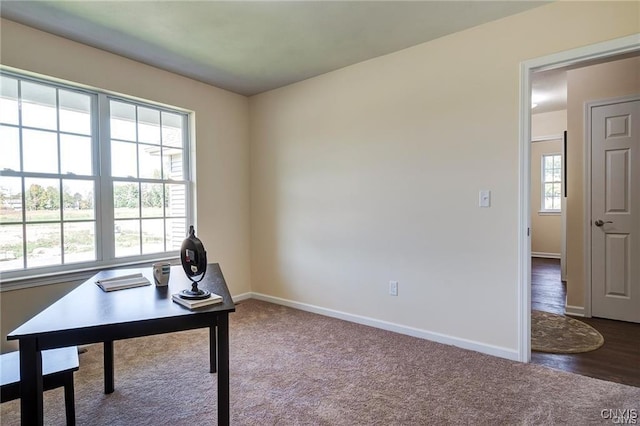 carpeted office featuring a healthy amount of sunlight