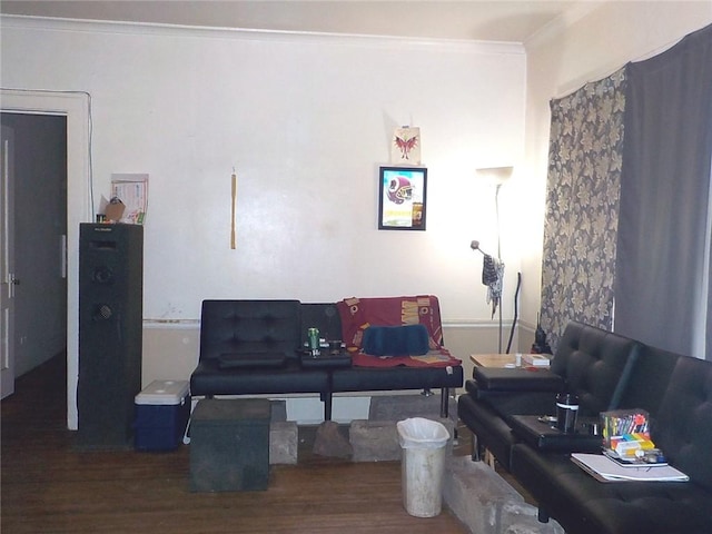 living room featuring dark wood-type flooring and crown molding