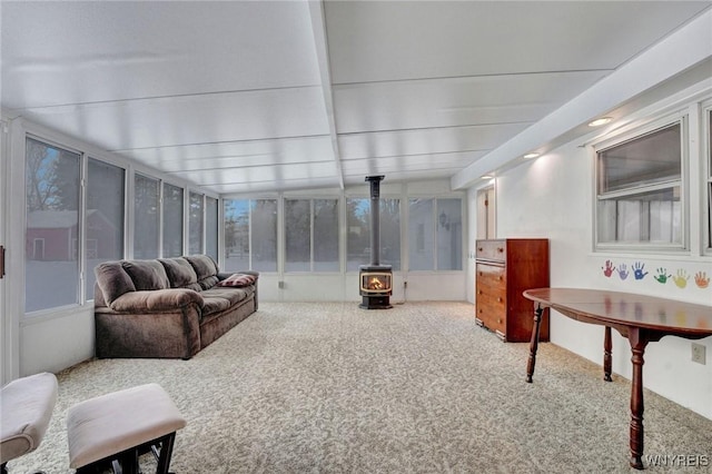 sunroom / solarium featuring a wood stove