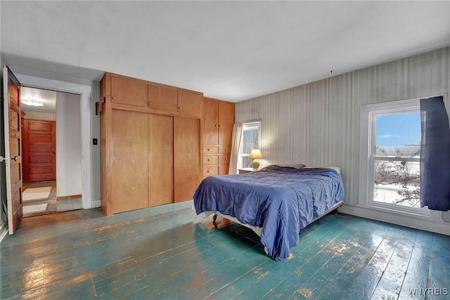 bedroom with dark hardwood / wood-style floors