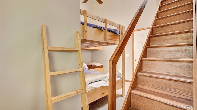 stairway with ceiling fan