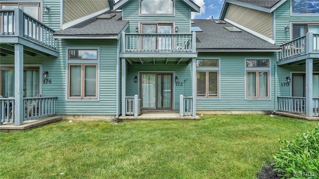 rear view of house with a lawn