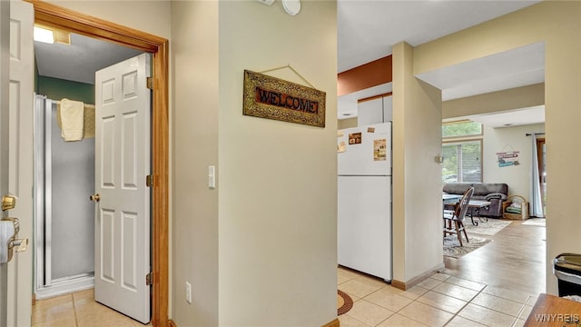 hallway with light tile patterned flooring