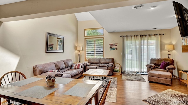 living room with light hardwood / wood-style flooring