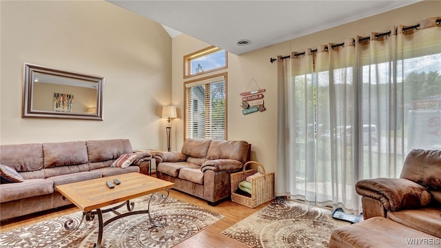 living room with light hardwood / wood-style flooring