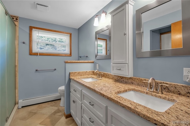 bathroom with toilet, an enclosed shower, vanity, and a baseboard radiator