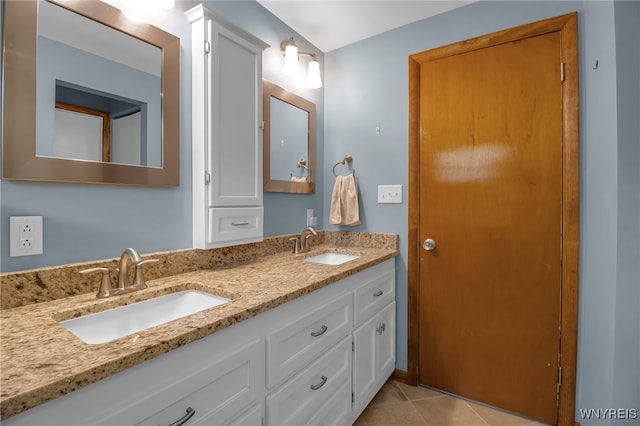 bathroom with tile patterned floors and vanity