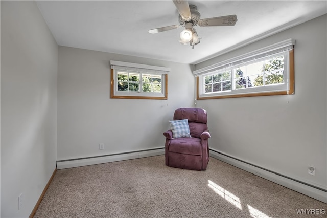 living area with carpet floors, a healthy amount of sunlight, and a baseboard radiator