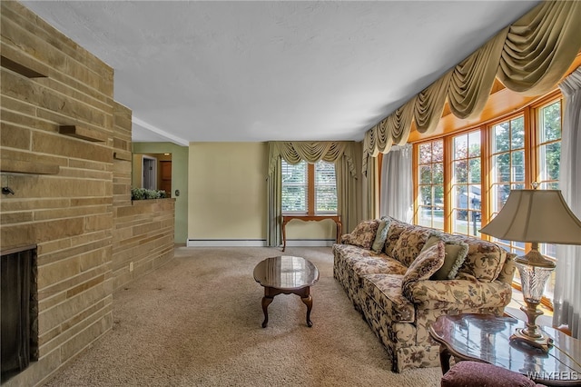 living room with a fireplace, carpet floors, and a baseboard radiator