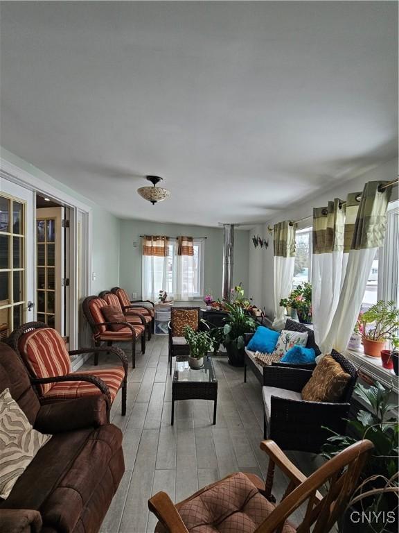 living room with a healthy amount of sunlight and french doors