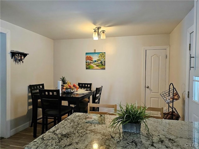 dining area with hardwood / wood-style flooring