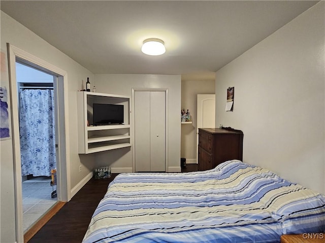 bedroom featuring dark hardwood / wood-style floors