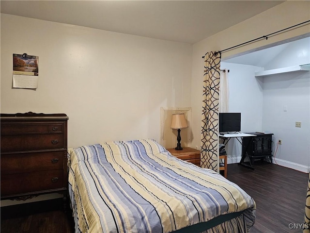 bedroom featuring dark hardwood / wood-style flooring