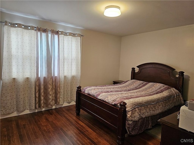 bedroom featuring dark hardwood / wood-style flooring