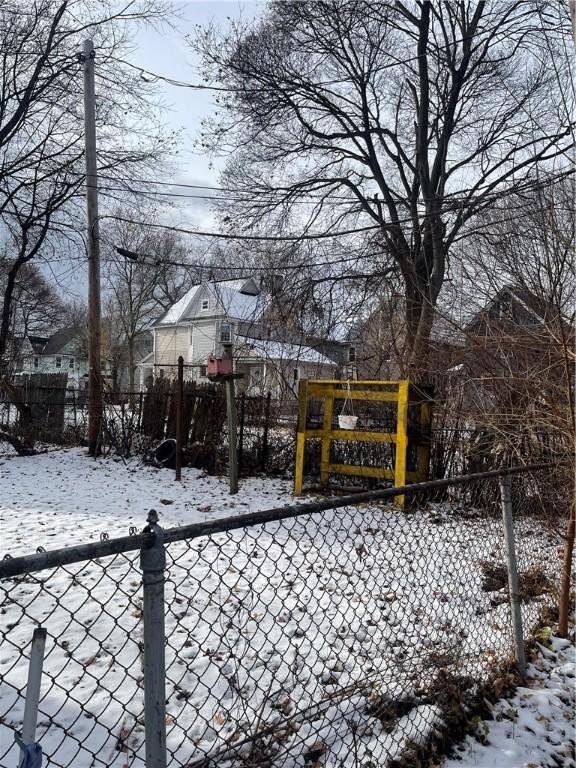 view of yard layered in snow