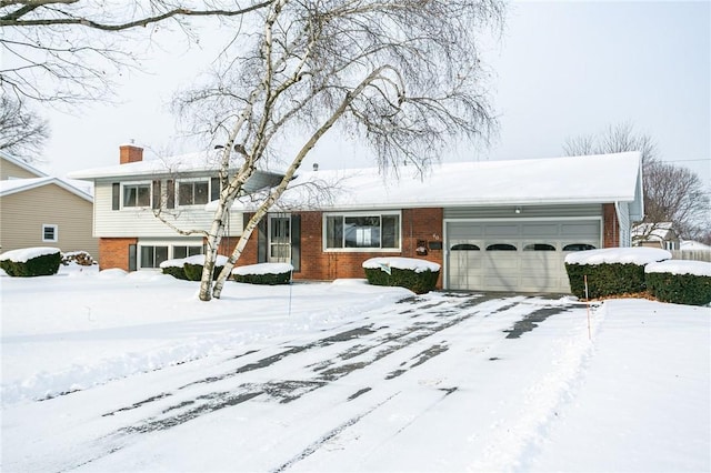 split level home with a garage