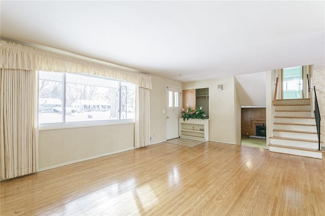 unfurnished living room with light hardwood / wood-style flooring