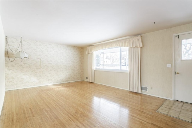 empty room featuring hardwood / wood-style floors