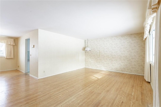 spare room featuring light wood-type flooring