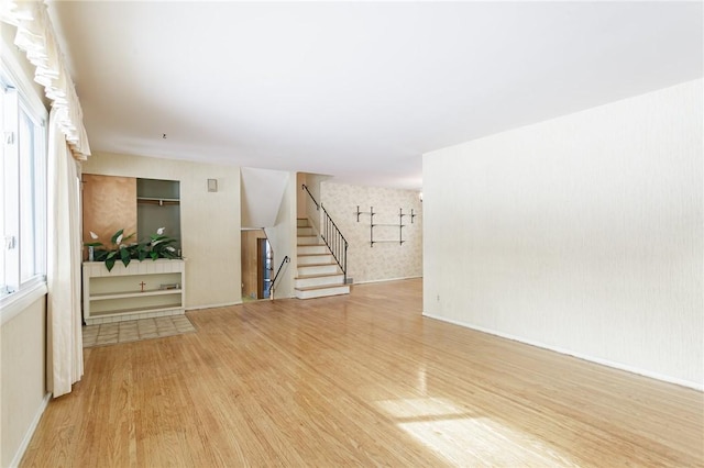 unfurnished room with wood-type flooring