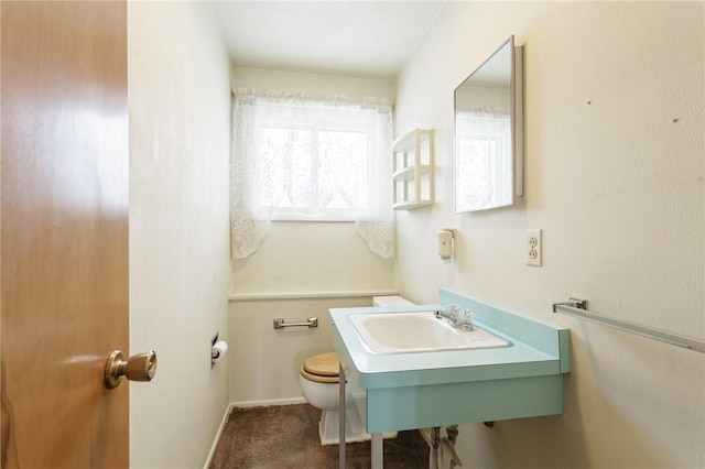 bathroom with toilet and sink