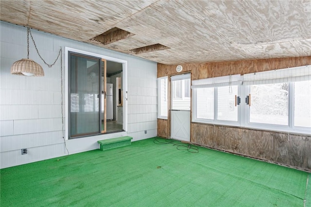 unfurnished sunroom with vaulted ceiling and wooden ceiling