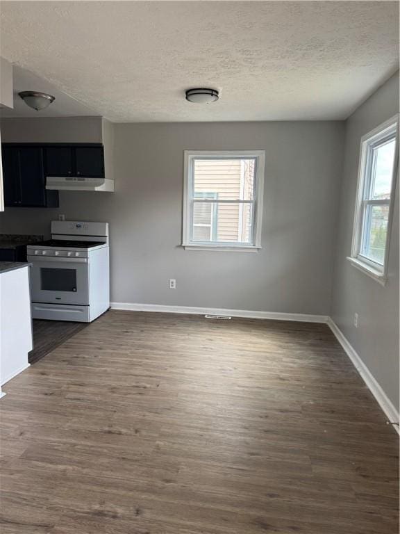 kitchen featuring a textured ceiling, white range with gas cooktop, and dark hardwood / wood-style flooring