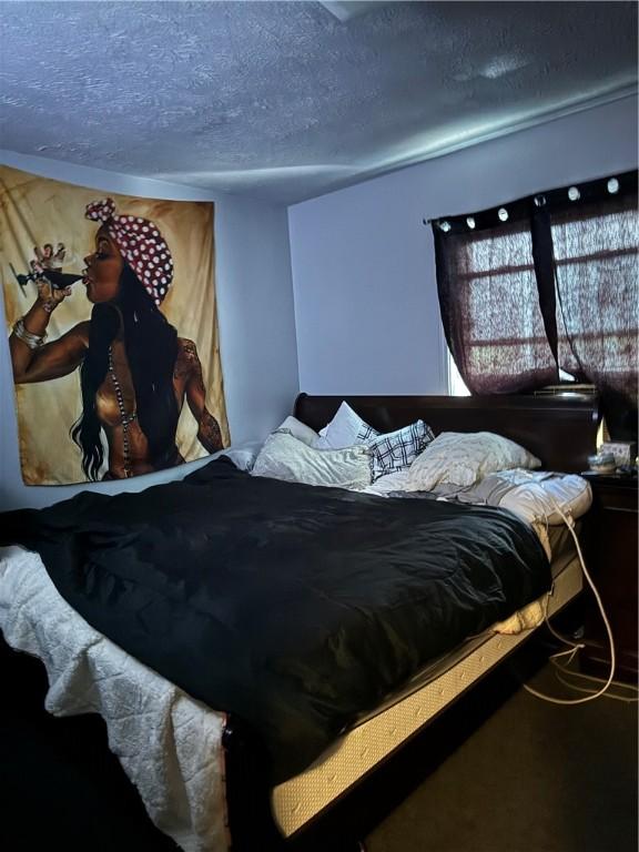 bedroom with a textured ceiling