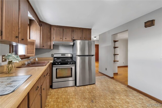 kitchen with appliances with stainless steel finishes and sink