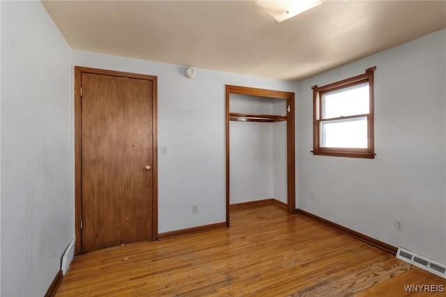 unfurnished bedroom featuring light wood-type flooring