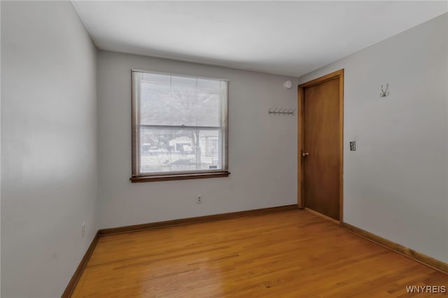 spare room featuring light hardwood / wood-style floors