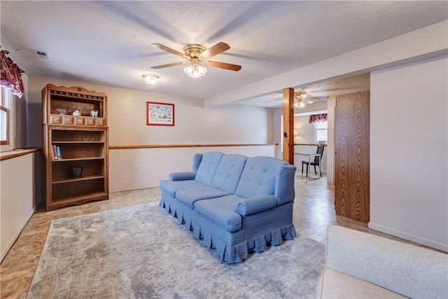 living room with ceiling fan