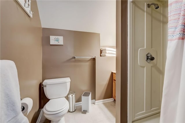 bathroom featuring curtained shower, tile patterned floors, toilet, and vanity