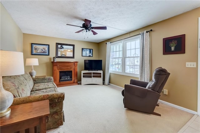 carpeted living room featuring a textured ceiling and ceiling fan