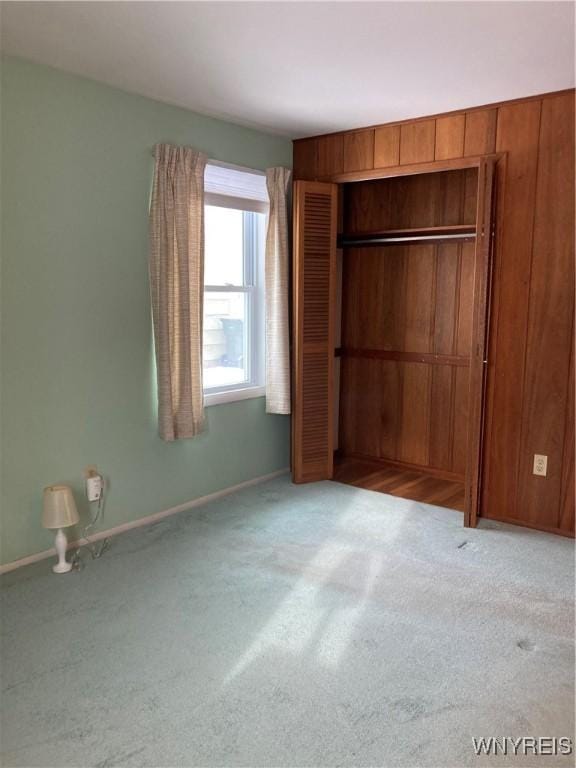 unfurnished bedroom with light carpet