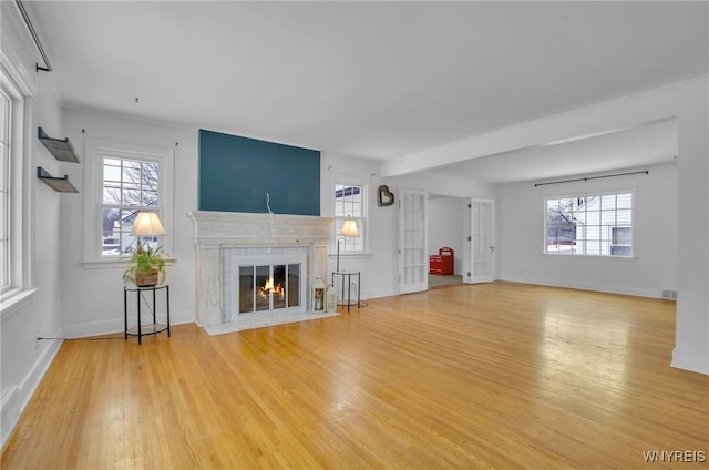 unfurnished living room featuring hardwood / wood-style floors