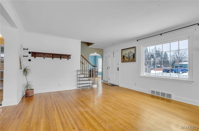 unfurnished living room featuring light hardwood / wood-style flooring